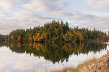 Autumn landscape with reflection on lake