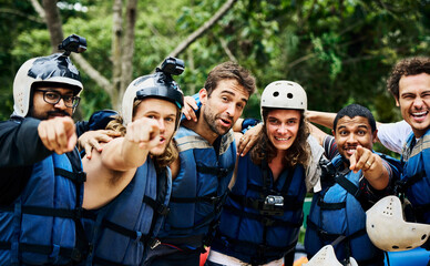 Rafting, portrait and team with helmet outdoor for safety, protection and ready for extreme sport. Group, face and happy men with life jacket for adventure, laughing and pointing at you in nature