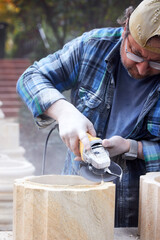 a male construction worker sawing stone 