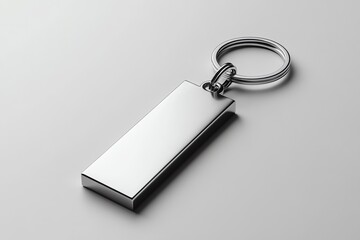 A Silver Metal Keychain with a Rectangular Tag