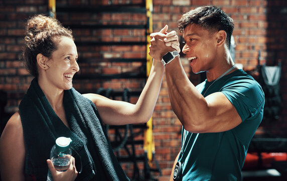 Fitness, people and high five for workout at gym with training success, target achievement or coach support. Personal trainer, team and celebration in sports center for intense exercise or body goals