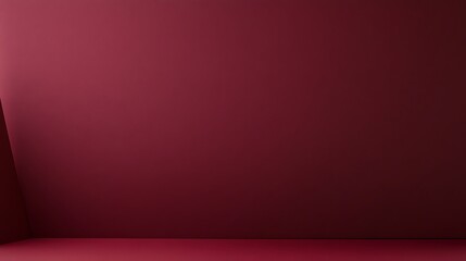 A minimalist room with a burgundy wall.