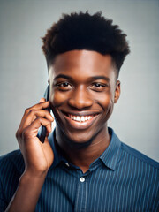 Smiling Young Black Man Talking on a Smartphone

