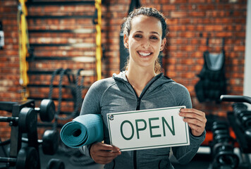 Portrait, woman and open sign for yoga class, fitness signage and advertising exercise of wellness poster . Smile, female trainer and welcome billboard with zen training, pilates information and gym