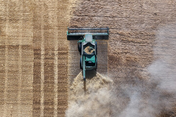 combine harvester harvesting wheat, aerial view