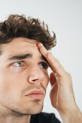 Thinking man, hand on forehead, looking stressed, pondering problem, headache concept