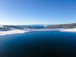 Fototapeta premium Winter view of Rila mountain near Belmeken Dam, Bulgaria