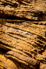 Textured sandstone rock face landscape, filling the frame