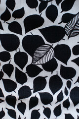 leaf pattern on fabric. Leaves of trees, bushes.  Sheer wallpaper in a rustic modern design.  textile texture.