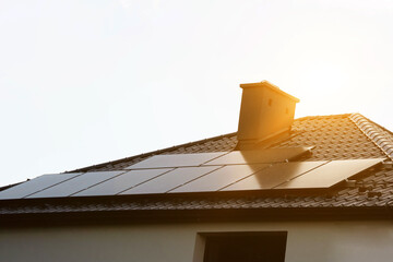 Solar power energy on the roof to a standard house. Solar power panels ,Photovoltaic modules for...