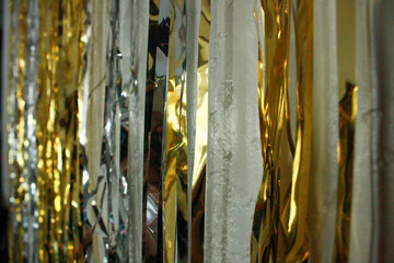 Gold and silver streamers along a wall