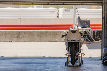 Motorcycle in pit garage