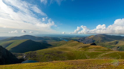 Obraz premium Panoramic view of the Snowdonia National Park mountains and lakes from a summit, Wales, UK.
