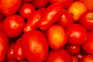 Variety of fresh ripe red tomatoes in the market