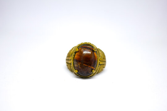 Brown agate ring (stone ring akik) with metal sprinkles isolated on white background