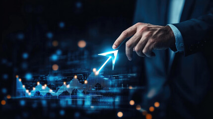 A man is pointing at a blue arrow on a computer screen. Concept of progress and growth, as the arrow represents a positive direction or movement