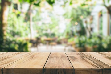 Empty wooden table top with blurred bokeh background of green garden and modern coffee shop interior, high definition wide-angle shot, boho aesthetic for product display.
