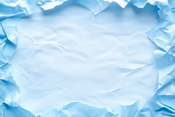 Obraz premium Crumpled blue paper background featuring a blank center for creative design and text placement