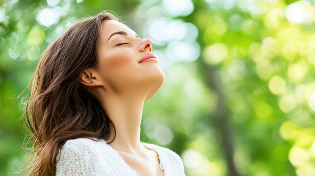 Relaxed woman enjoying fresh air outdoors with eyes closed in nature