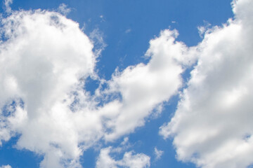 White passenger airplane flying in the sky amazing clouds in the background - Travel by air transport. High quality photo
