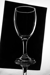 pouring water Empty wine glass isolated on black and white, glass use mockup