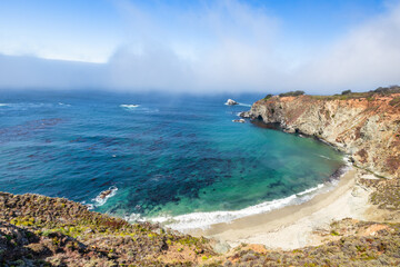 Beautiful landscape of Pacific Ocean coast along Highway 1 and Big Sur, aerial view, sunset, sunrise, fog. Concept, travel, vacation, weekend