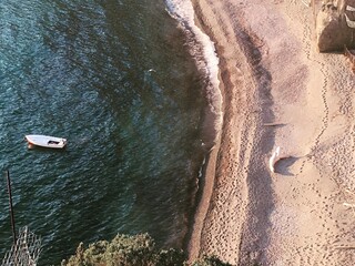 Aerial View of a beach. Half the image of the sea, other half of the sand. Vertical shoreline