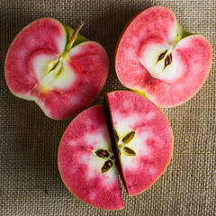 Hidden Rose apples, cut in half to show the distinctive red and white inner flesh
