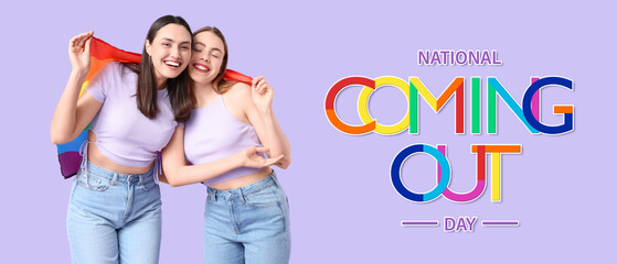 Beautiful young lesbian couple with LGBT flag on lilac background