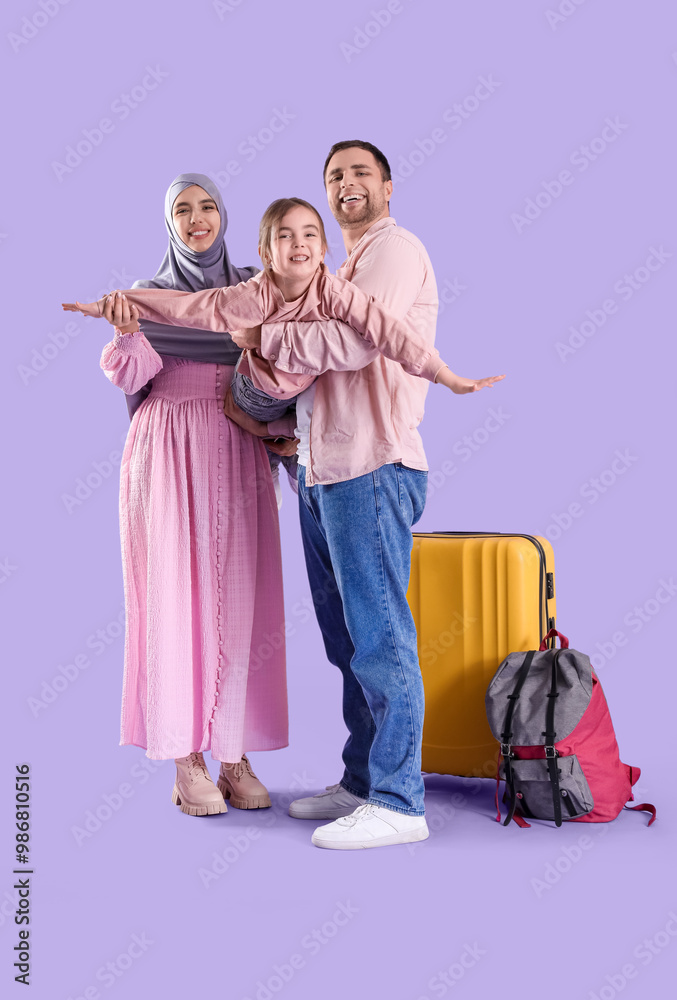 Poster Beautiful Muslim family with suitcase and backpack on lilac background. Travel concept