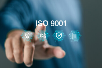 Person touching ISO 9001 icon for quality management of organizations. ISO 9001 standard certification standardisation quality control concept.