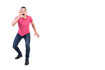 Amazed man screaming news with eyes wide open