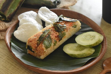 delicious and delicious grilled rice food menu wrapped in banana leaves. Baked rice is a traditional Indonesian food.