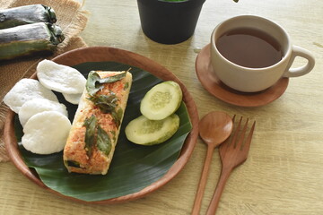 delicious and delicious grilled rice food menu wrapped in banana leaves. Baked rice is a traditional Indonesian food.