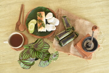 delicious and delicious grilled rice food menu wrapped in banana leaves. Baked rice is a traditional Indonesian food.