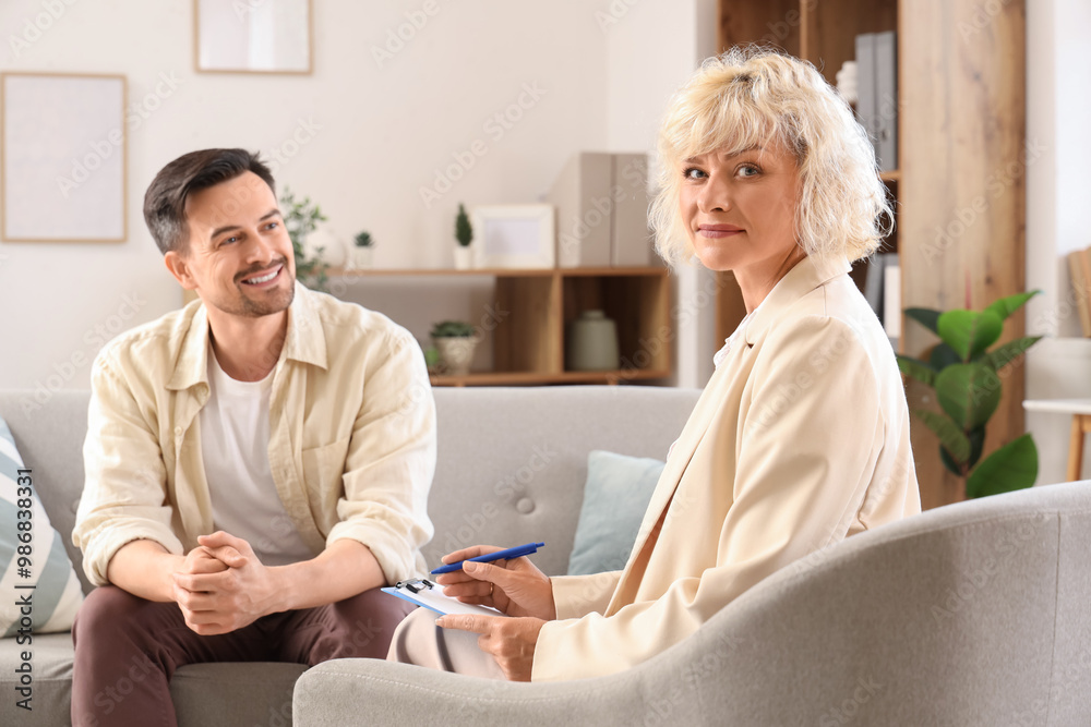 Poster Female psychologist working with young man in office