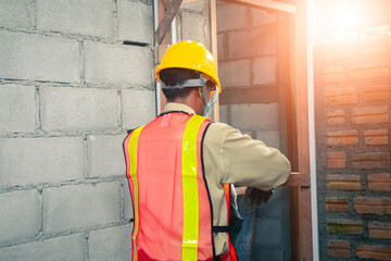 The architect walks the site to ensure precision in building.