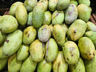 Background of pile of green mango fruit