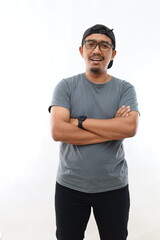 Young handsome man with beard wearing casual glasses over white background happy face smiling with crossed arms looking at the camera. Positive person.