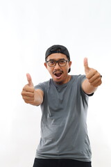 Young handsome man with beard wearing casual sweater and glasses over white background approving doing positive gesture with hand, thumbs up smiling and happy for success. Winner gesture.