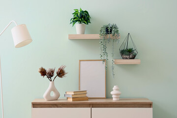 Interior of room with commode, shelves and lamp