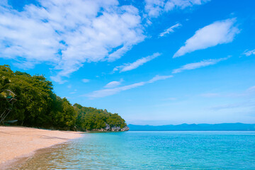 Fototapeta premium Walking along the white sand of Talipasak Beach. Romblon Island, Philippines