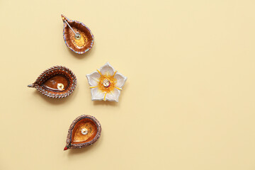 Diya lamps on yellow background. Divaly celebration