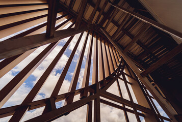 A structure featuring wooden slats on construction site contributing to its architectural style