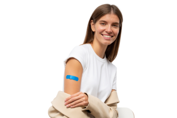 Portrait of happy vaccinated female smiling after getting vaccine shot. Woman holding down her sleeve to show her arm with blue bandage after vaccination