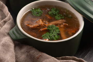 Soup with chanterelle mushrooms close up