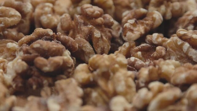 Close up of peeled walnuts with smooth rotation motion
