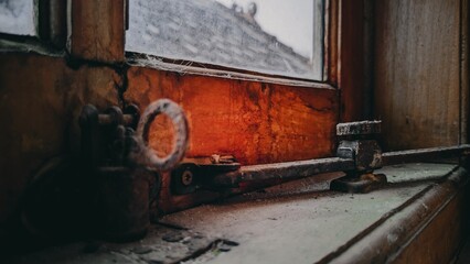 Close up old window with rusty key