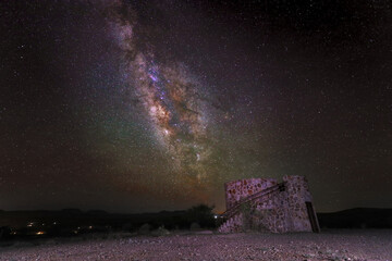 Stone tower under the milky way galactic core at Davis Mountains State Park Fort Davis, Texas.