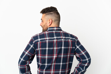 Fototapeta premium Caucasian man isolated on white background in back position and looking side